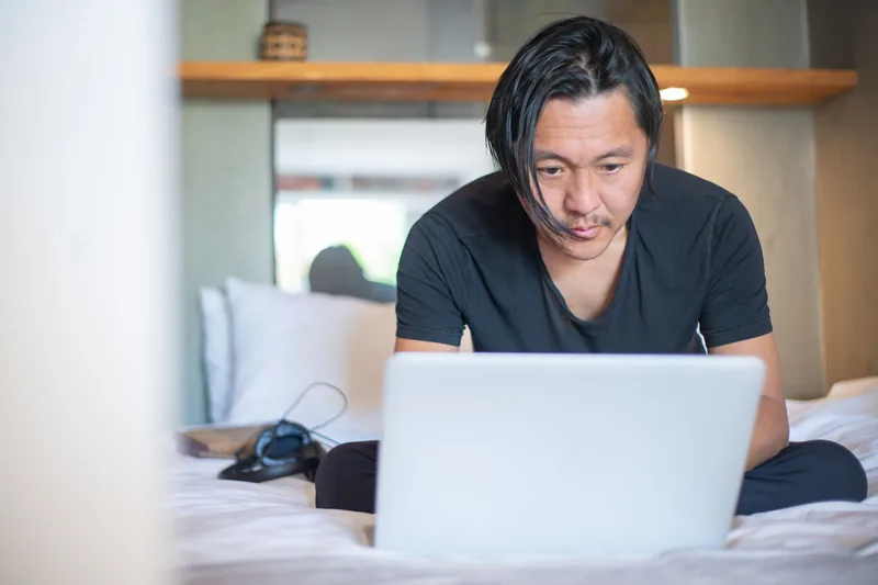Someone working on a laptop at home